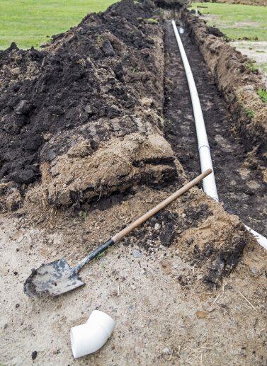 Drain field pipe repair work in an open trench